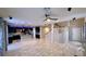 Open floor plan featuring kitchen, dining area, staircase, and entryway at 7788 Ebro Valley Ct, Las Vegas, NV 89113