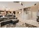 Open concept living space showcasing the staircase, kitchen with island seating, and living room area at 7788 Ebro Valley Ct, Las Vegas, NV 89113