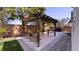 Outdoor pergola area with bench seating creating a serene space for relaxation and socializing at 7788 Ebro Valley Ct, Las Vegas, NV 89113