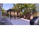 Backyard featuring pergola area with ample seating for outdoor living and entertaining at 7788 Ebro Valley Ct, Las Vegas, NV 89113
