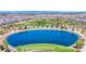 Expansive aerial view of neighborhood lake, park, and distant city skyline at 789 Goodman Cove St, Henderson, NV 89011