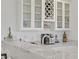 The bar area includes white cabinets, wine rack, and glass ware storage at 789 Goodman Cove St, Henderson, NV 89011