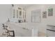 The bar area includes a sink, a beverage refrigerator, and white cabinetry at 789 Goodman Cove St, Henderson, NV 89011
