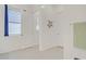 Bathroom with a window, a door, a towel rack, and tile floors at 789 Goodman Cove St, Henderson, NV 89011