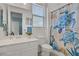 Bright bathroom featuring white vanity, ample lighting, and marine-themed shower curtain at 789 Goodman Cove St, Henderson, NV 89011