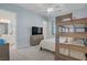 Airy bedroom featuring bunk beds, television, and a convenient bathroom entrance at 789 Goodman Cove St, Henderson, NV 89011