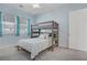 Bedroom with bunk bed, carpet, and lots of natural light at 789 Goodman Cove St, Henderson, NV 89011