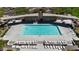 Community pool showcasing a large swimming area with lounge chairs and shaded seating for relaxation and enjoyment at 789 Goodman Cove St, Henderson, NV 89011