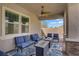 The covered patio includes comfortable seating and a ceiling fan for outdoor relaxation at 789 Goodman Cove St, Henderson, NV 89011