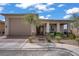 Beautiful one-story home with a two-car garage, desert landscaping, and a covered porch at 789 Goodman Cove St, Henderson, NV 89011