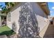 Home exterior featuring neat landscaping, rock and artificial turf with the covered patio extending from the rear at 789 Goodman Cove St, Henderson, NV 89011