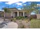 Charming home with manicured front yard, featuring gravel landscaping, mature trees, and a covered porch at 789 Goodman Cove St, Henderson, NV 89011