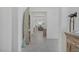 Hallway features decorative boat shelving unit and view to dining room at 789 Goodman Cove St, Henderson, NV 89011