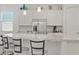 Kitchen island featuring granite counters, stainless appliances and bar stool seating at 789 Goodman Cove St, Henderson, NV 89011