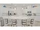Modern kitchen with an island, stainless steel appliances, granite countertops and white cabinets at 789 Goodman Cove St, Henderson, NV 89011