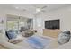 Bright living room with sliding glass doors leading to the backyard patio at 789 Goodman Cove St, Henderson, NV 89011