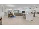 Bright, open living space with kitchen island, dining area, and spacious living room at 789 Goodman Cove St, Henderson, NV 89011
