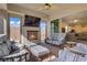 Inviting covered patio with a cozy fireplace and comfortable seating at 789 Goodman Cove St, Henderson, NV 89011