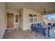 Inviting covered porch with brick flooring, a ceiling fan, and comfortable outdoor furniture for relaxing moments at 789 Goodman Cove St, Henderson, NV 89011