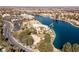 Gorgeous aerial view showcases the pool, sport court and green space on the waterfront at 8109 Moonstone Cir, Las Vegas, NV 89128