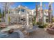 Backyard with stone patio, outdoor furniture and seating, lounge chairs, and swimming pool at 8109 Moonstone Cir, Las Vegas, NV 89128