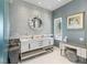 Elegant bathroom featuring double sinks, a vanity area, and modern lighting fixtures at 8109 Moonstone Cir, Las Vegas, NV 89128