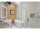 Elegant bathroom with a standalone tub, glass shower, and modern vanity at 8109 Moonstone Cir, Las Vegas, NV 89128