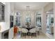 Bright dining room with a modern light fixture and backyard views at 8109 Moonstone Cir, Las Vegas, NV 89128