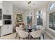 Dining room featuring modern light fixture and backyard views at 8109 Moonstone Cir, Las Vegas, NV 89128