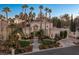 Stately home with circular driveway, mature trees, and manicured landscaping at 8109 Moonstone Cir, Las Vegas, NV 89128