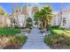 Inviting front entrance featuring a manicured lawn and grand staircase at 8109 Moonstone Cir, Las Vegas, NV 89128
