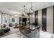 Spacious living room with a bar area featuring pendant lighting and modern finishes at 8109 Moonstone Cir, Las Vegas, NV 89128