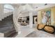 Spacious living room with a staircase, modern fireplace and decor at 8109 Moonstone Cir, Las Vegas, NV 89128