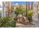 Built in outdoor kitchen and grilling area with stainless steel grill and natural stone features at 8109 Moonstone Cir, Las Vegas, NV 89128
