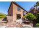 Beautiful two-story house exterior with landscaped backyard and lush plants at 853 Ashford Way, Henderson, NV 89015