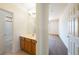 Bathroom with a vanity sink, mirror, and combined shower and tub at 853 Ashford Way, Henderson, NV 89015