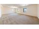 A large bedroom features neutral carpet, large windows, and a ceiling fan at 853 Ashford Way, Henderson, NV 89015