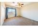Large bedroom featuring neutral walls, carpet flooring, and a bright window at 853 Ashford Way, Henderson, NV 89015