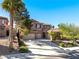 Two-story home with three-car garage, well-maintained landscaping and mature shade trees at 853 Ashford Way, Henderson, NV 89015