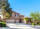 Two-story home with three-car garage, well-maintained landscaping and mature shade trees at 853 Ashford Way, Henderson, NV 89015