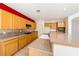 Spacious kitchen boasts granite countertops, wooden cabinetry, tile backsplash, and modern appliances at 853 Ashford Way, Henderson, NV 89015