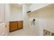 Laundry room featuring wooden cabinets, and a shelf at 853 Ashford Way, Henderson, NV 89015