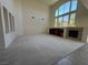 Large, open living room featuring carpet flooring, high ceilings, and ample natural light at 853 Ashford Way, Henderson, NV 89015