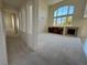 Spacious living room featuring high ceilings, built-in shelving, fireplace, and lots of natural light at 853 Ashford Way, Henderson, NV 89015