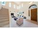 Bright living room with tall ceilings and multiple windows at 853 Ashford Way, Henderson, NV 89015