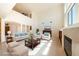 Bright living room with high ceilings, neutral decor, and large windows at 853 Ashford Way, Henderson, NV 89015