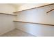 Spacious walk-in closet with multiple shelves for optimal storage, and tile flooring at 853 Ashford Way, Henderson, NV 89015