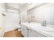 Bright bathroom with a double sink vanity, bathtub, and tile flooring at 9539 Iris Flat Ct, Las Vegas, NV 89178