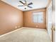 Cozy bedroom with carpet, ceiling fan, window, and closet at 9539 Iris Flat Ct, Las Vegas, NV 89178