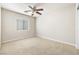 Spacious bedroom featuring carpet, ceiling fan, and a window at 9539 Iris Flat Ct, Las Vegas, NV 89178